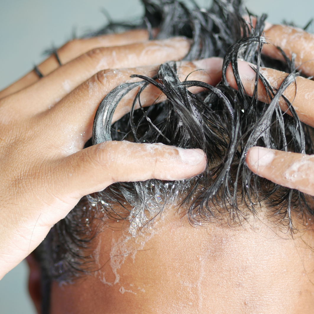 Brightpack 2-in-1 Shampoo being used, cleansing and conditioning.