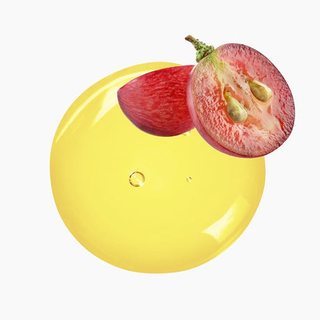 Sliced Grape With Seeds Exposed Atop A Circular Blob Of Yellow Oil | Bulk Oils | Brightpack Raw Materials